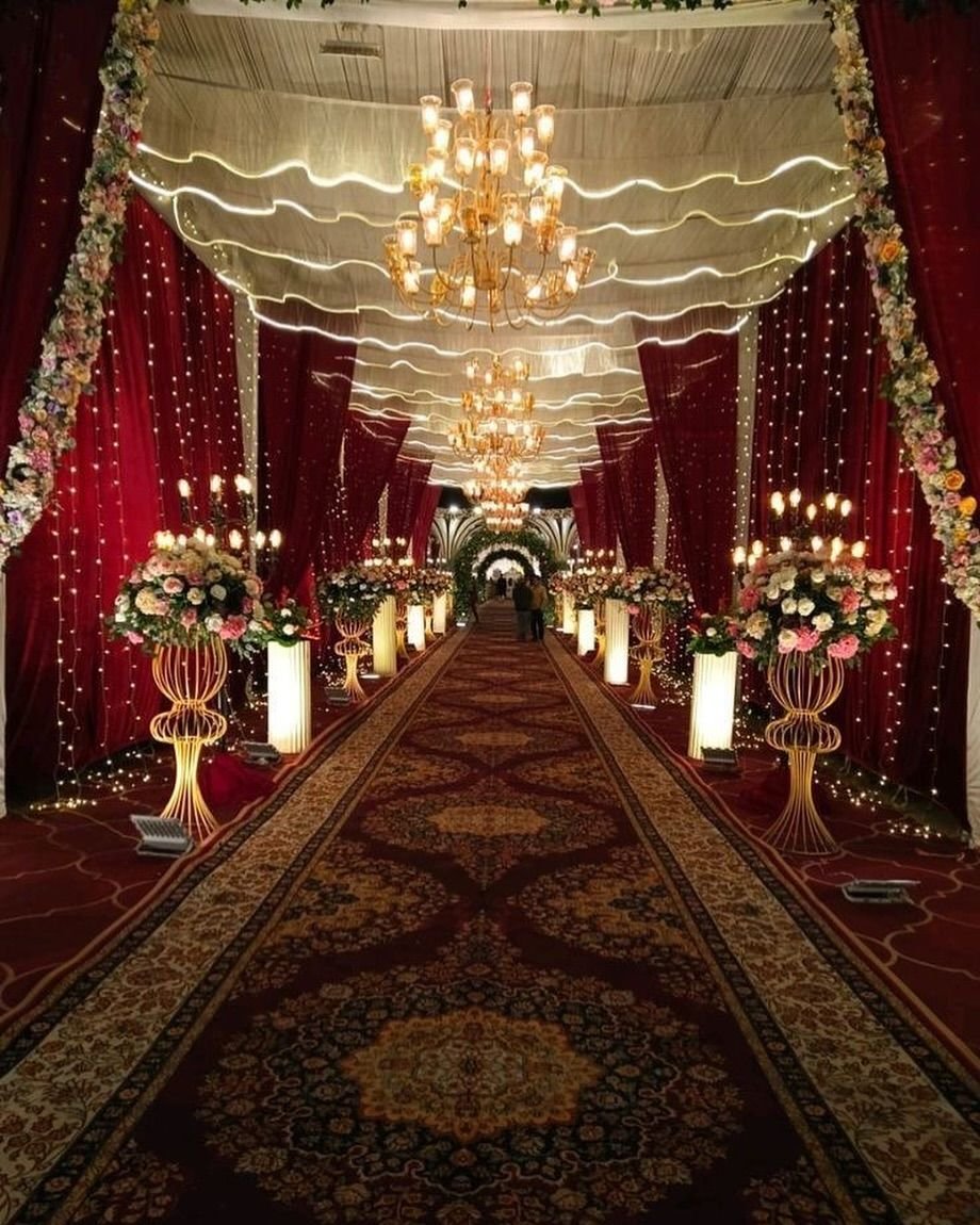 Elegant wedding reception stage featuring backdrop lighting and floral design