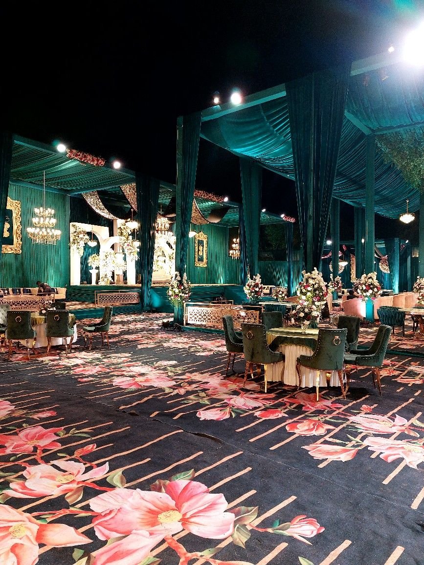 Scenic open-air lawn wedding night illumination and seating arrangement